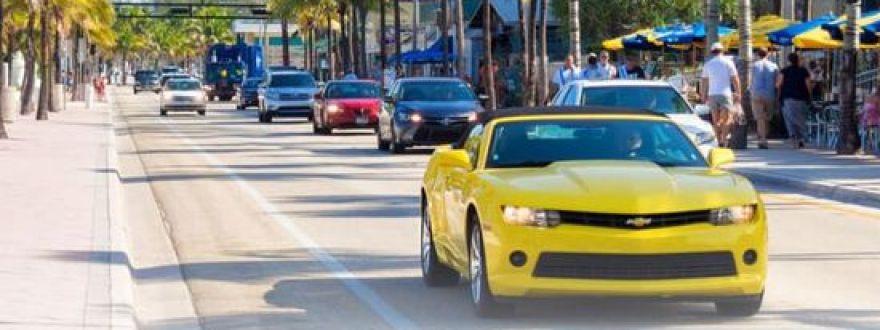 yellow chevy camaro on driving through South Florida beaches