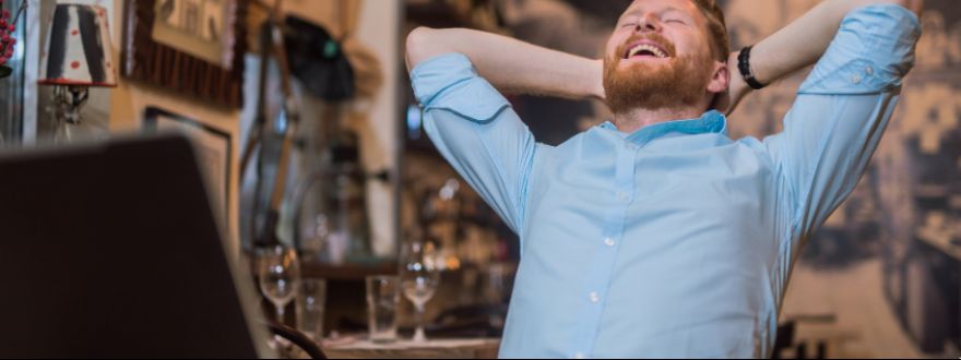 man smiling on a chair