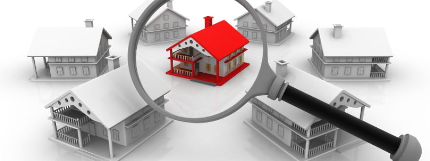 red house under a magnifying glass