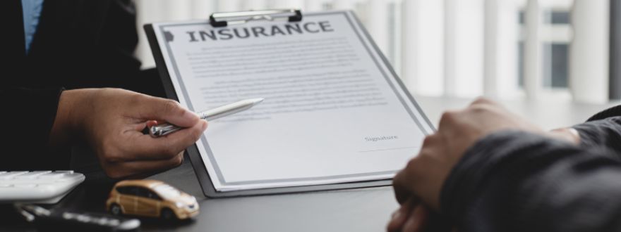 an insurance agent from American US Insurance explaining a homeowners insurance policy to a client