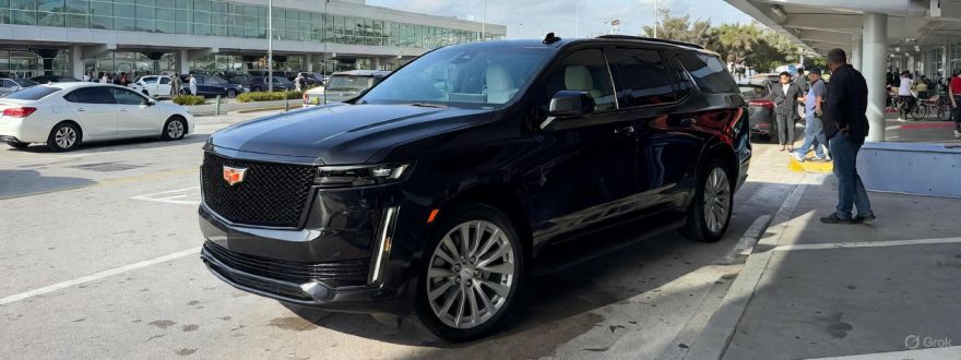 black car limousine parked on a street side