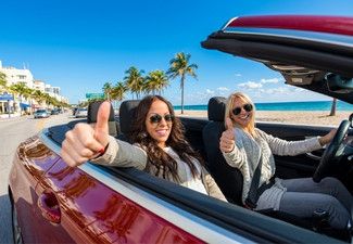 pretty woman driving a car insured by American US Insurance