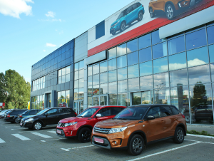 vehicles at a dealership waiting to be transported by a transportation expert in Miami Florida