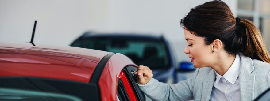 girl getting on a car