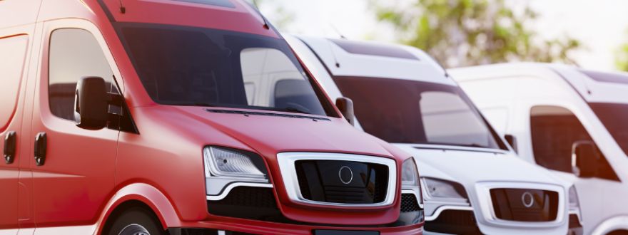 White church van parked outside a Monroe, Georgia church building, representing commercial auto insurance for churches