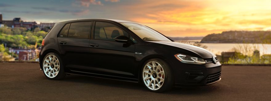 black car with sunset in the background