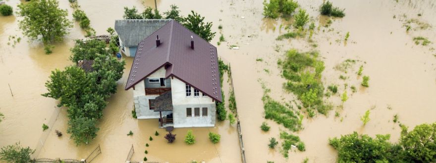 home surrounded by flood