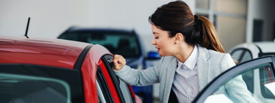 woman getting in her car