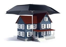 Model of a two story house under a black umbrella