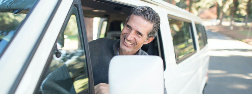 man inside his car