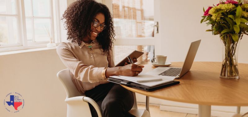 a woman on a lap top searching for texas business insurance quotes 