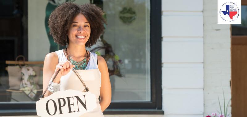 A lady outside her shop with GL insurance 