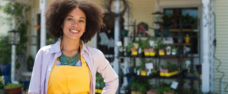 A woman business owner outside her store