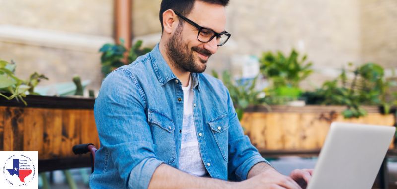 a man on a laptop buying texas business insurance