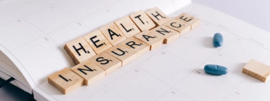 Health Insurance Scrabble Tiles on Planner