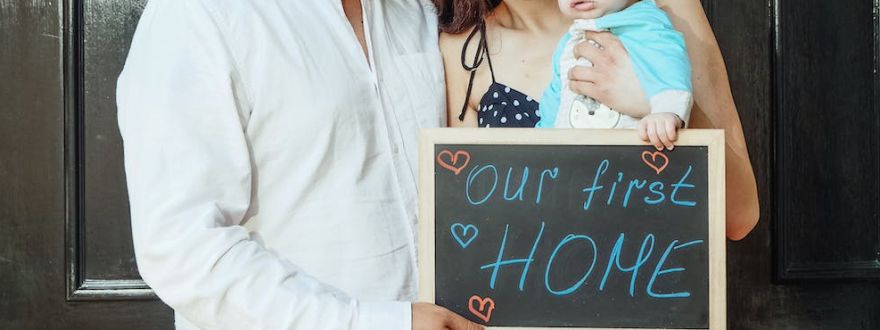 picture of family holding a signage