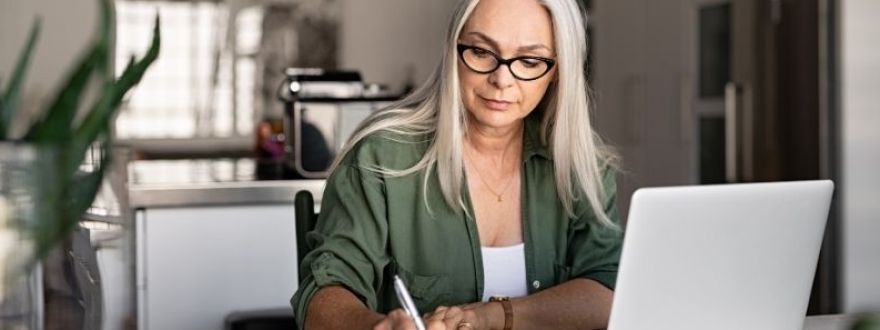 a woman setting up an LLC at home 