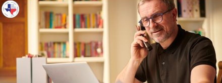 A man on a laptop learning about the risks dallas businesses face - he has business insurance in dallas tx 