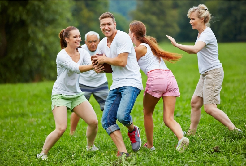 A group playing football, with health insurance Coppell, TX